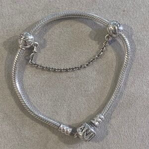 Pandora bracelet with “Family forever” charm